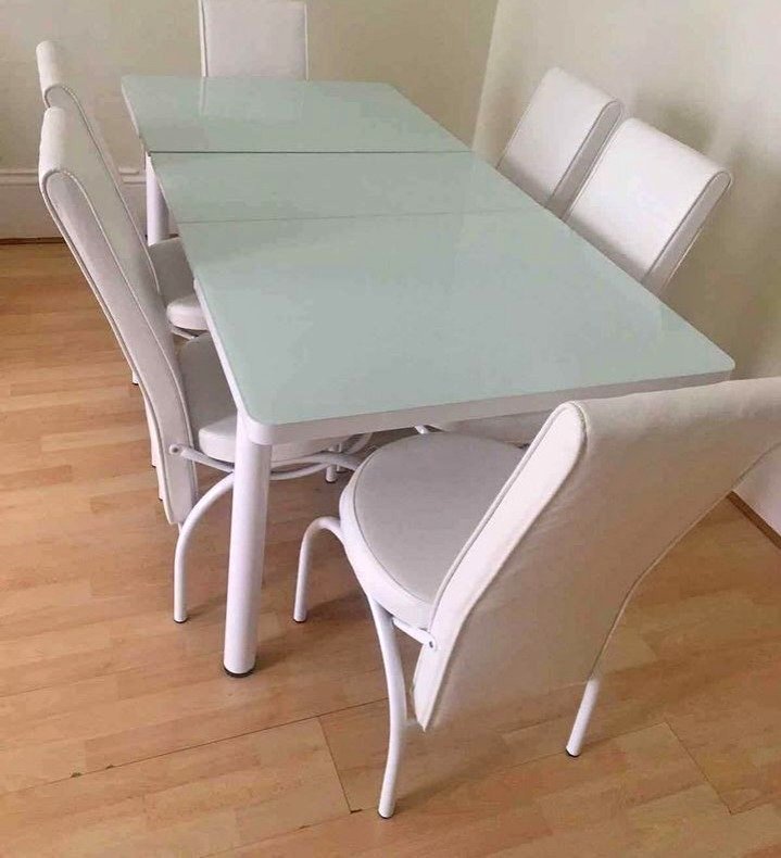 contemporary minimalist white dining suite with ergonomic high back chairs